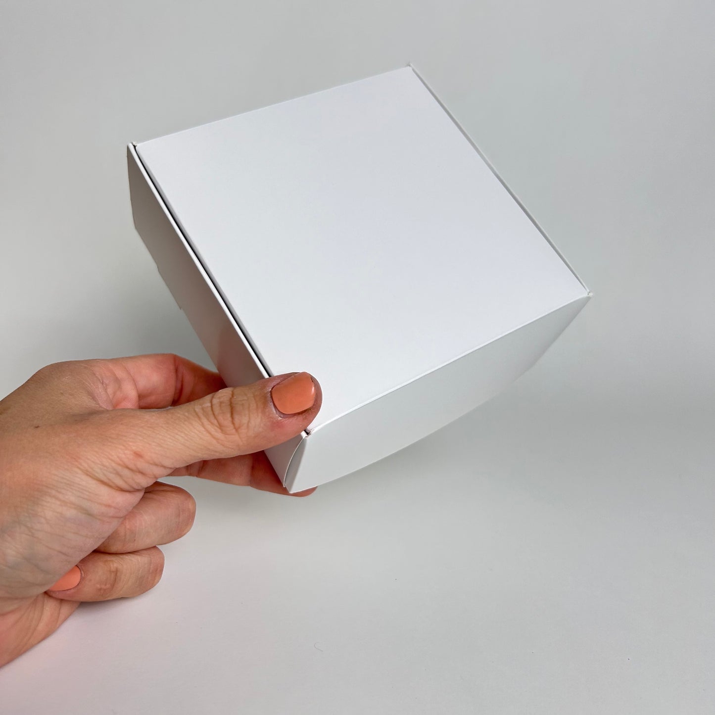 Caja 12x12x5 cm Cartulina Blanca X100 unds.