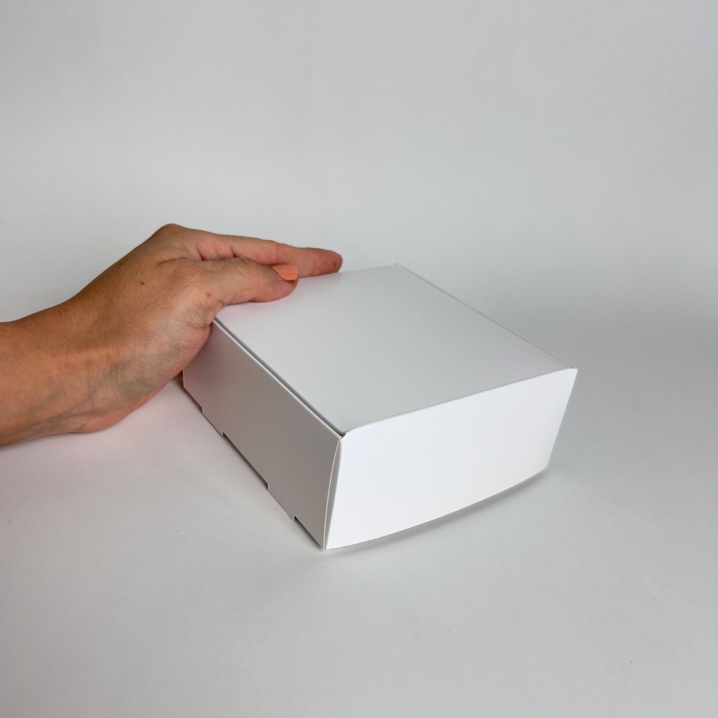 Caja 12x12x5 cm Cartulina Blanca X100 unds.